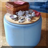 F20. Round blue ottoman with wooden top. 